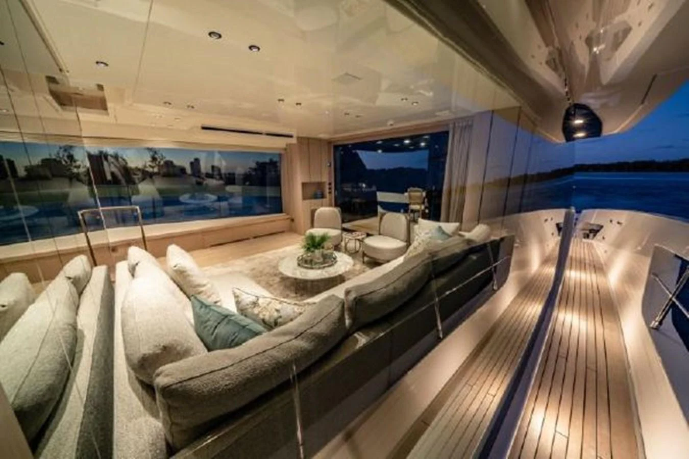a room with a couch and a table aboard SANLORENZO SX76 Yacht for Sale