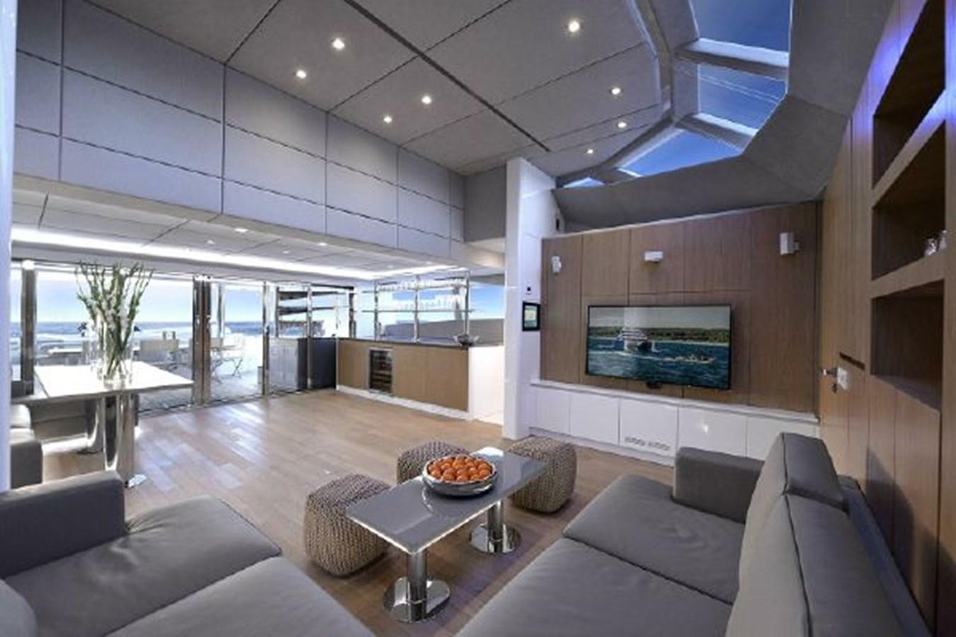 a living room with a large window aboard 2015 SUNREEF 70 Yacht for Sale