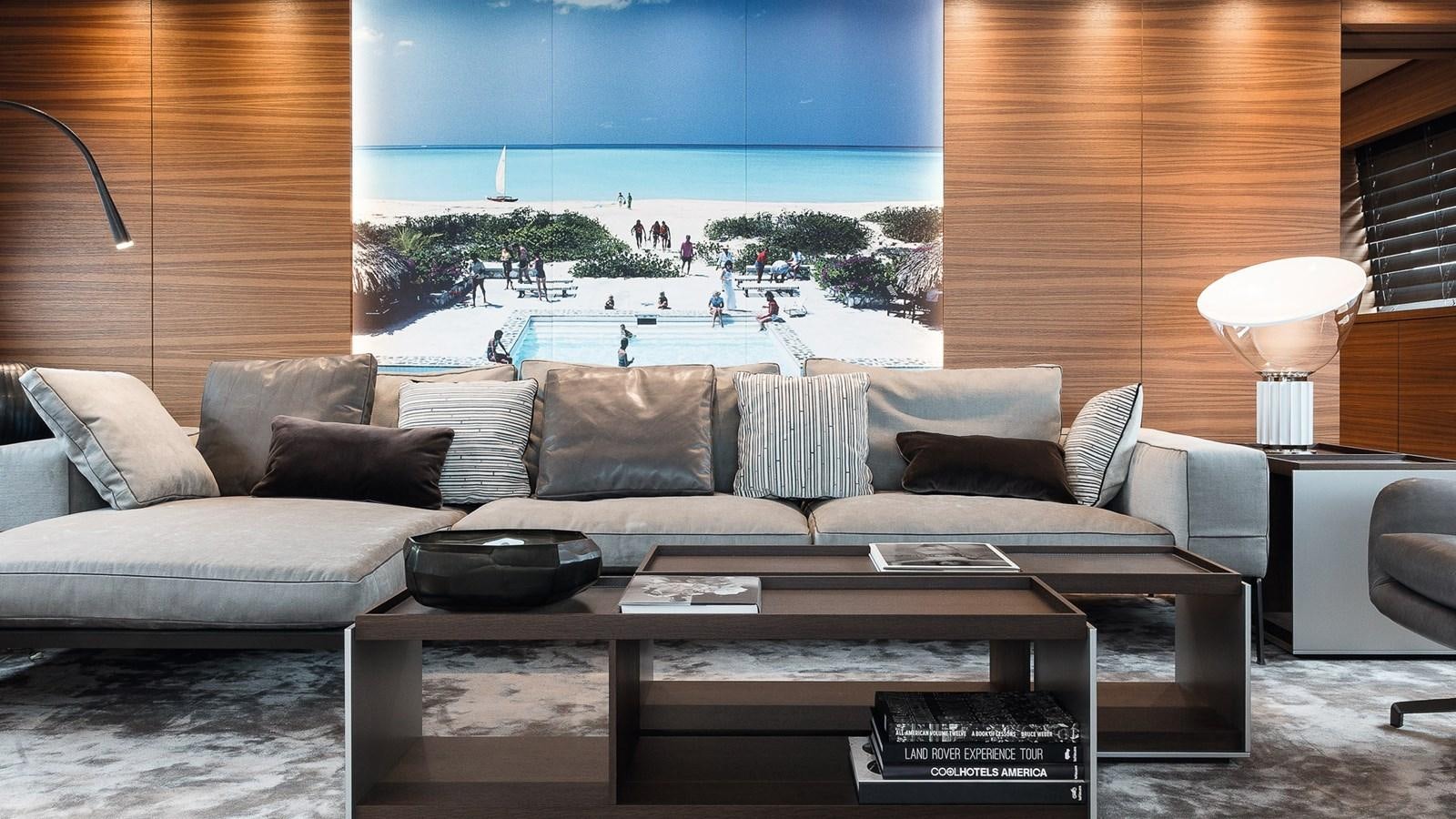 a living room with a couch and a table aboard SILVER EDGE Yacht for Sale