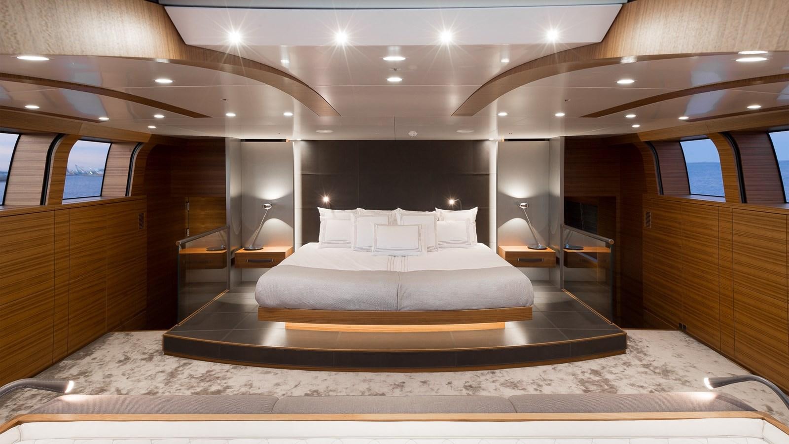 a large bed in a room aboard SILVER EDGE Yacht for Sale