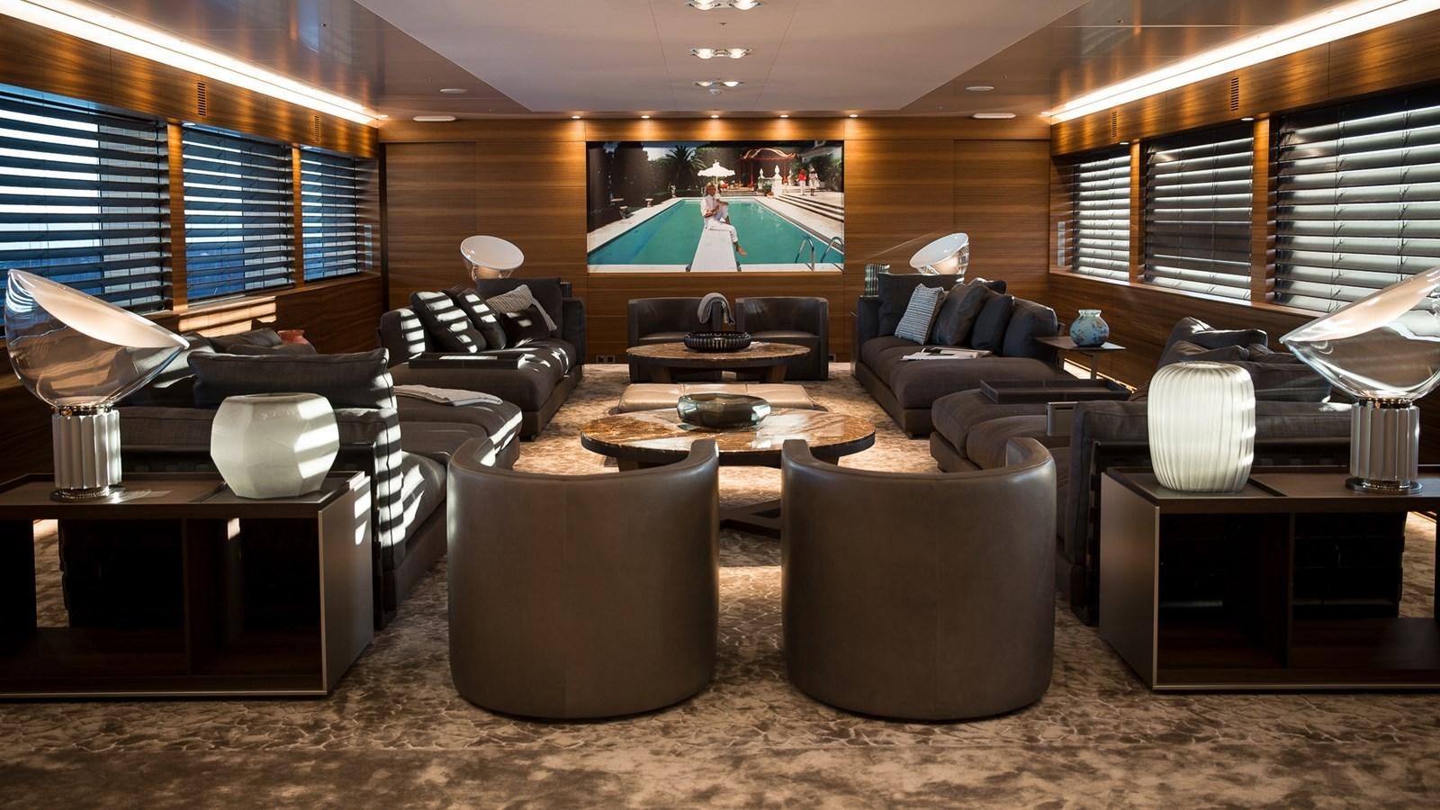 a living room with a large screen aboard SILVER EDGE Yacht for Sale