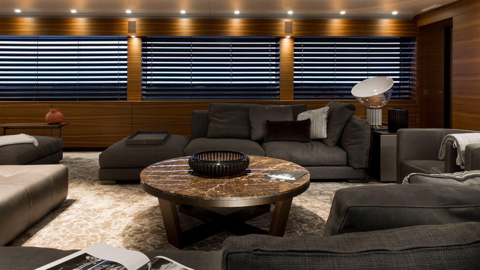 a living room with a couch and a coffee table aboard SILVER EDGE Yacht for Sale