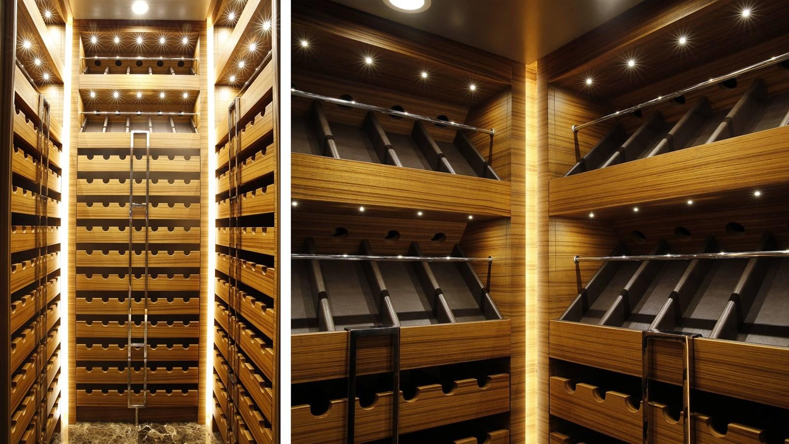 a large room with several bookshelves aboard SILVER EDGE Yacht for Sale