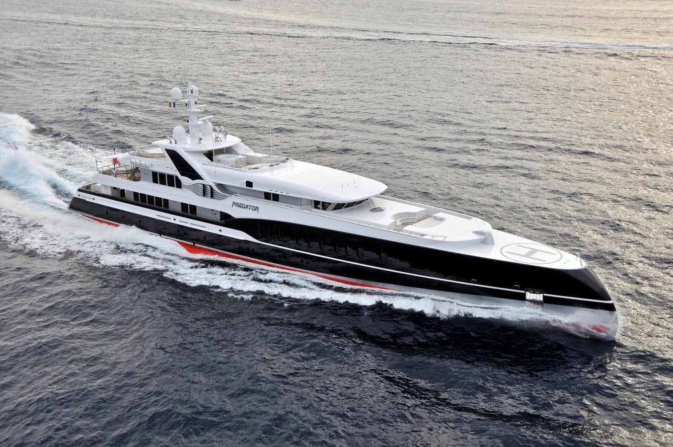 a white and black boat aboard PREDATOR Yacht for Sale