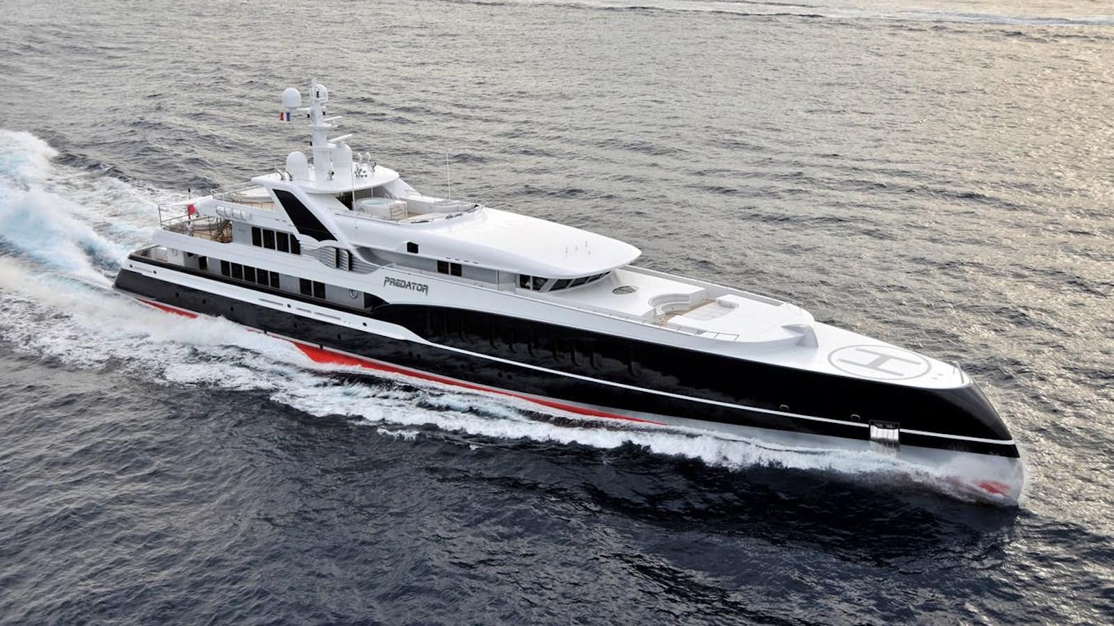 a white and black boat aboard PREDATOR Yacht for Sale