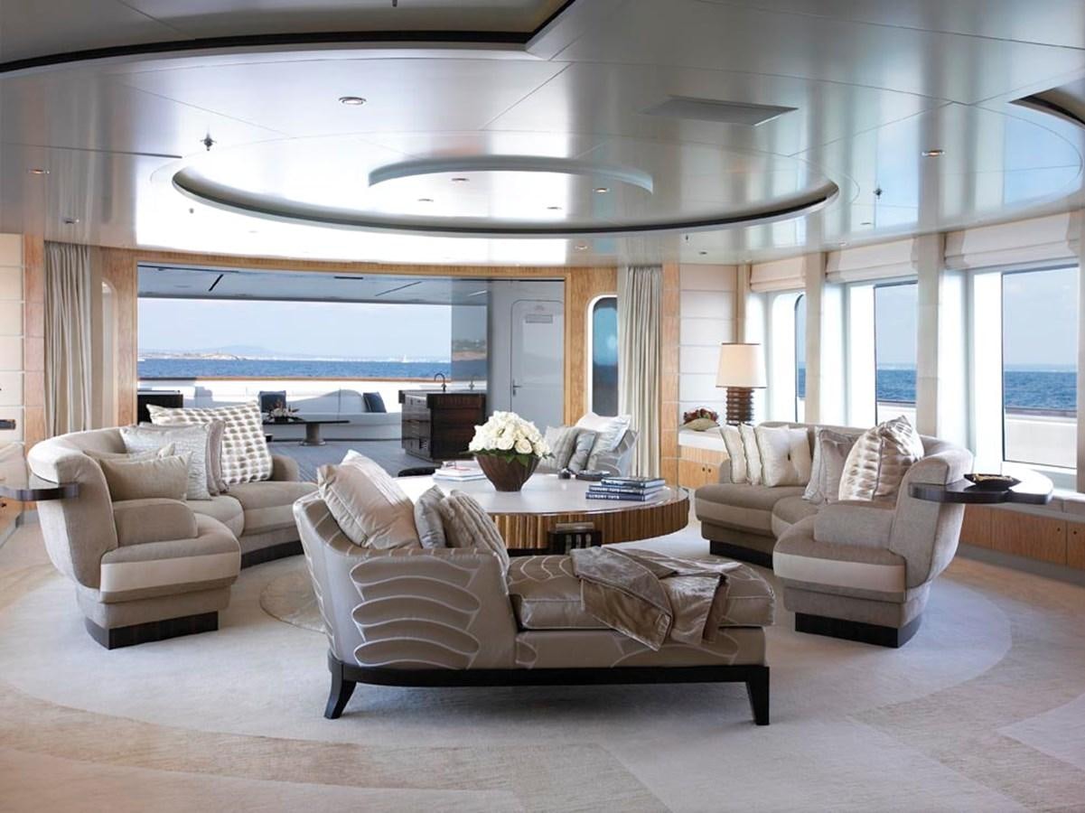 a living room with a large window aboard PREDATOR Yacht for Sale