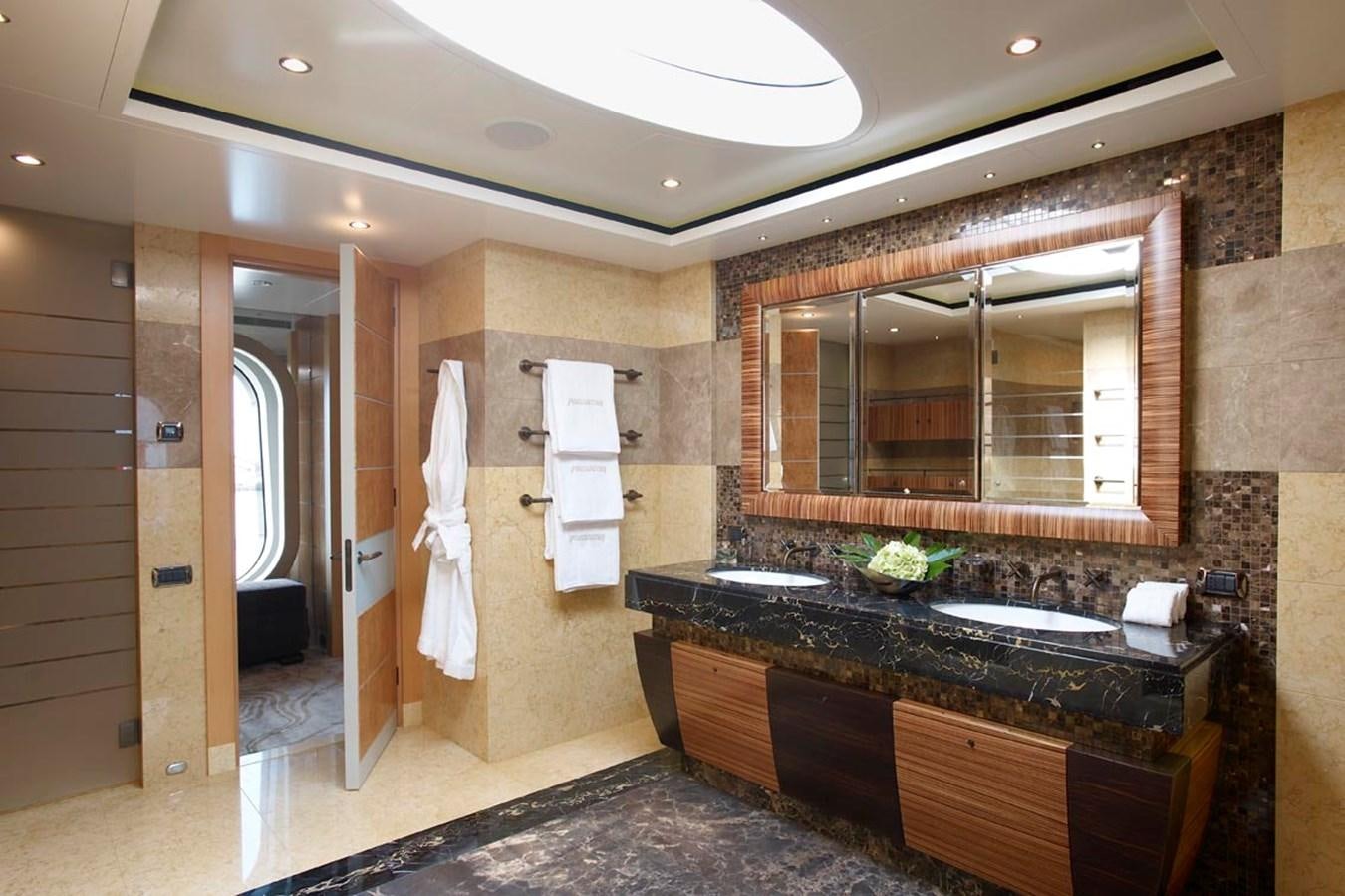 a bathroom with a marble counter top aboard PREDATOR Yacht for Sale
