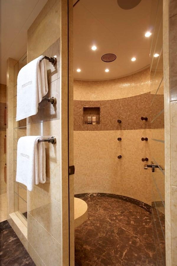 a bathroom with a large marble shower aboard PREDATOR Yacht for Sale