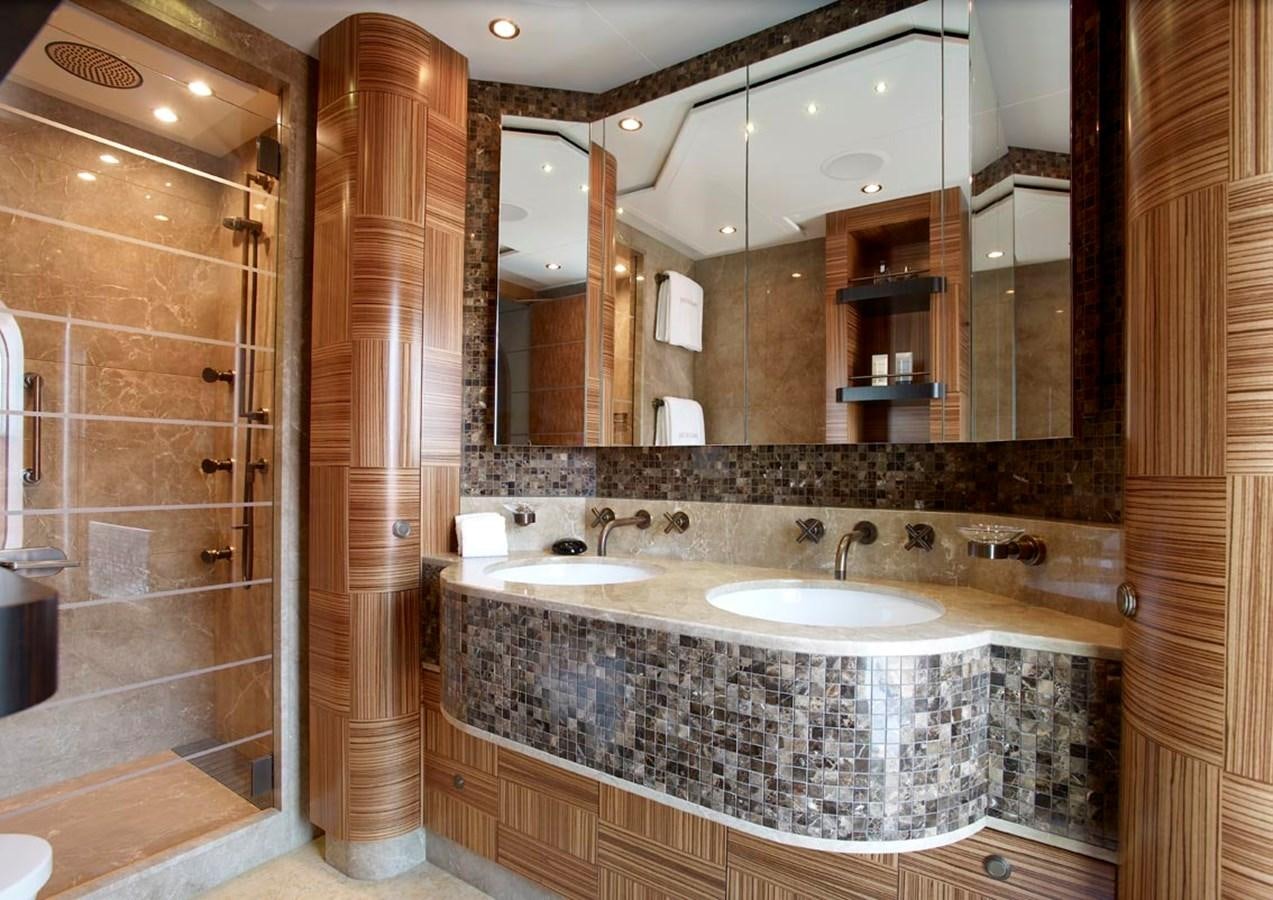 a bathroom with a marble counter top aboard PREDATOR Yacht for Sale