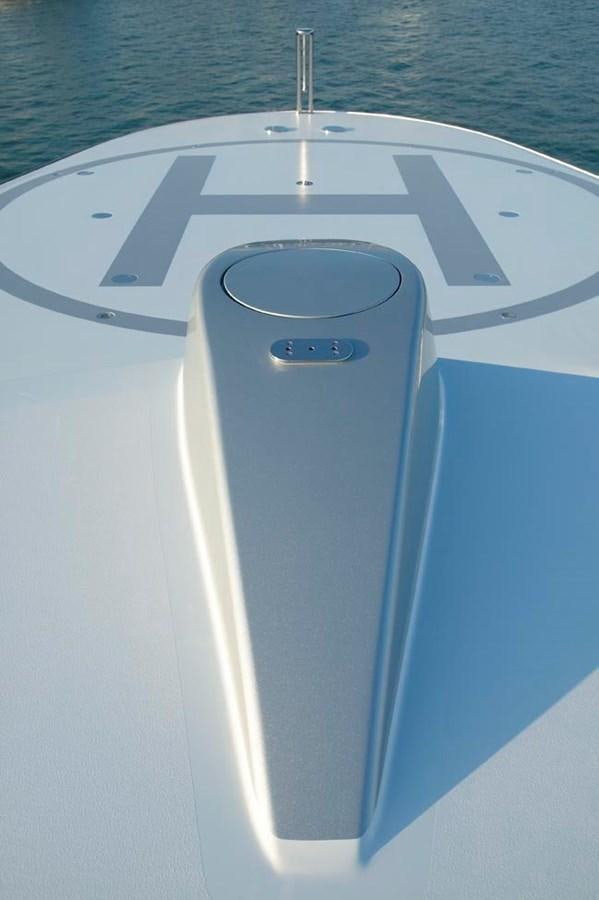 a white and blue boat aboard PREDATOR Yacht for Sale