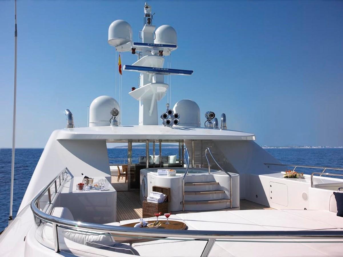 a boat with a satellite dish on the deck aboard PREDATOR Yacht for Sale