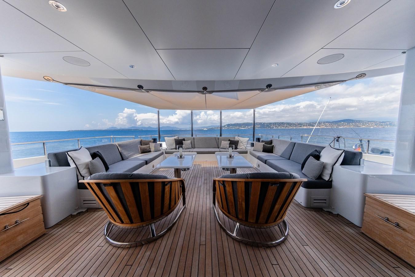a room with a table and chairs aboard VAN TOM Yacht for Sale