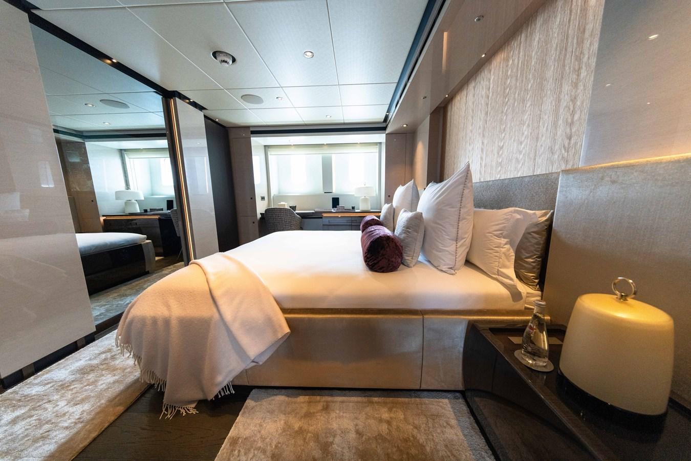 a room with a bed and a table aboard VAN TOM Yacht for Sale