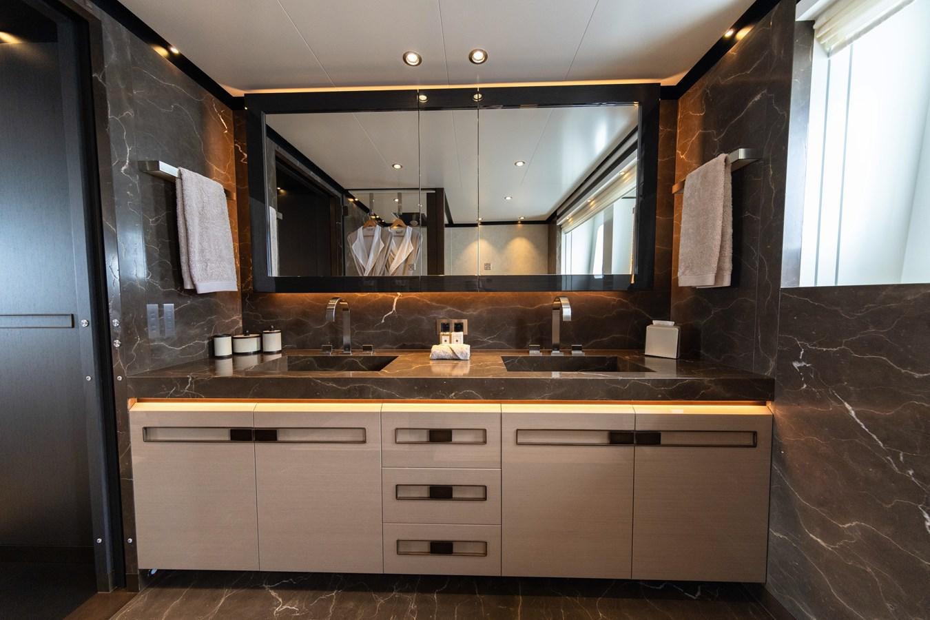 a bathroom with a large mirror aboard VAN TOM Yacht for Sale