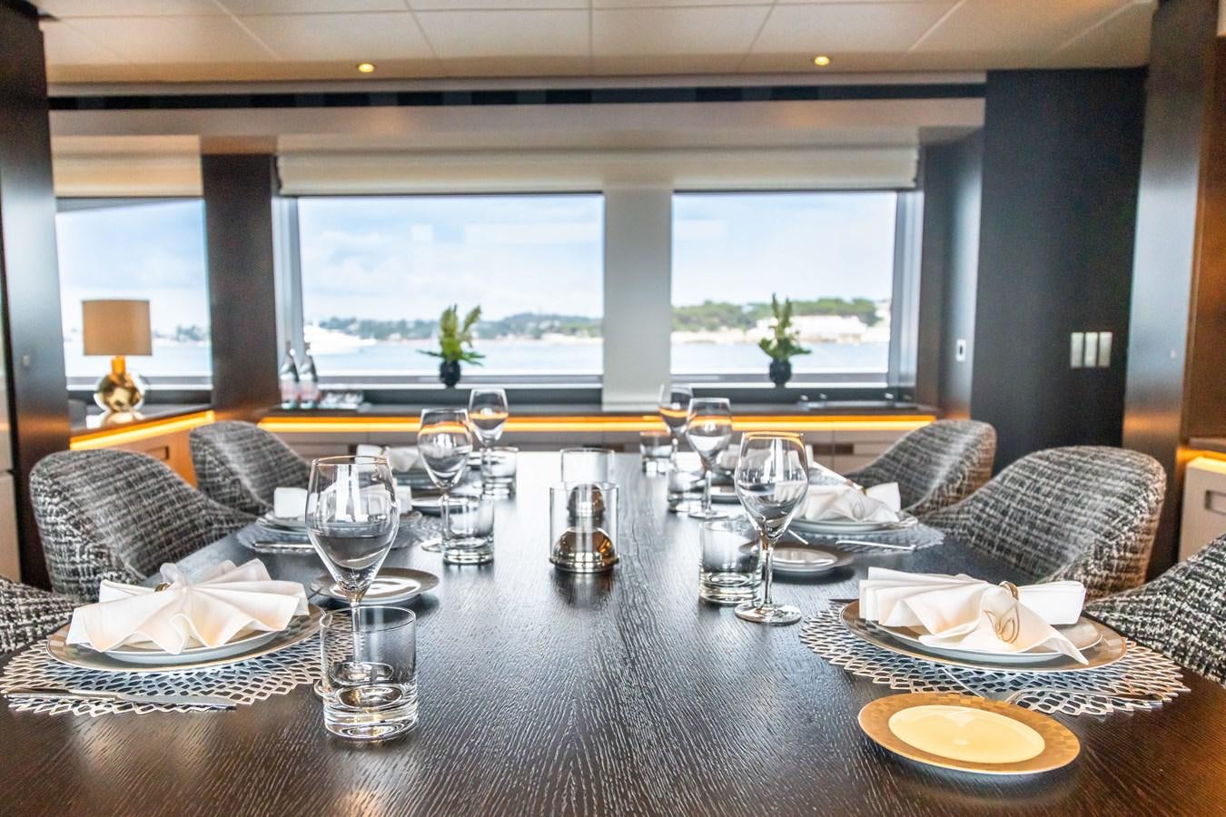 a table with empty glasses aboard VAN TOM Yacht for Sale