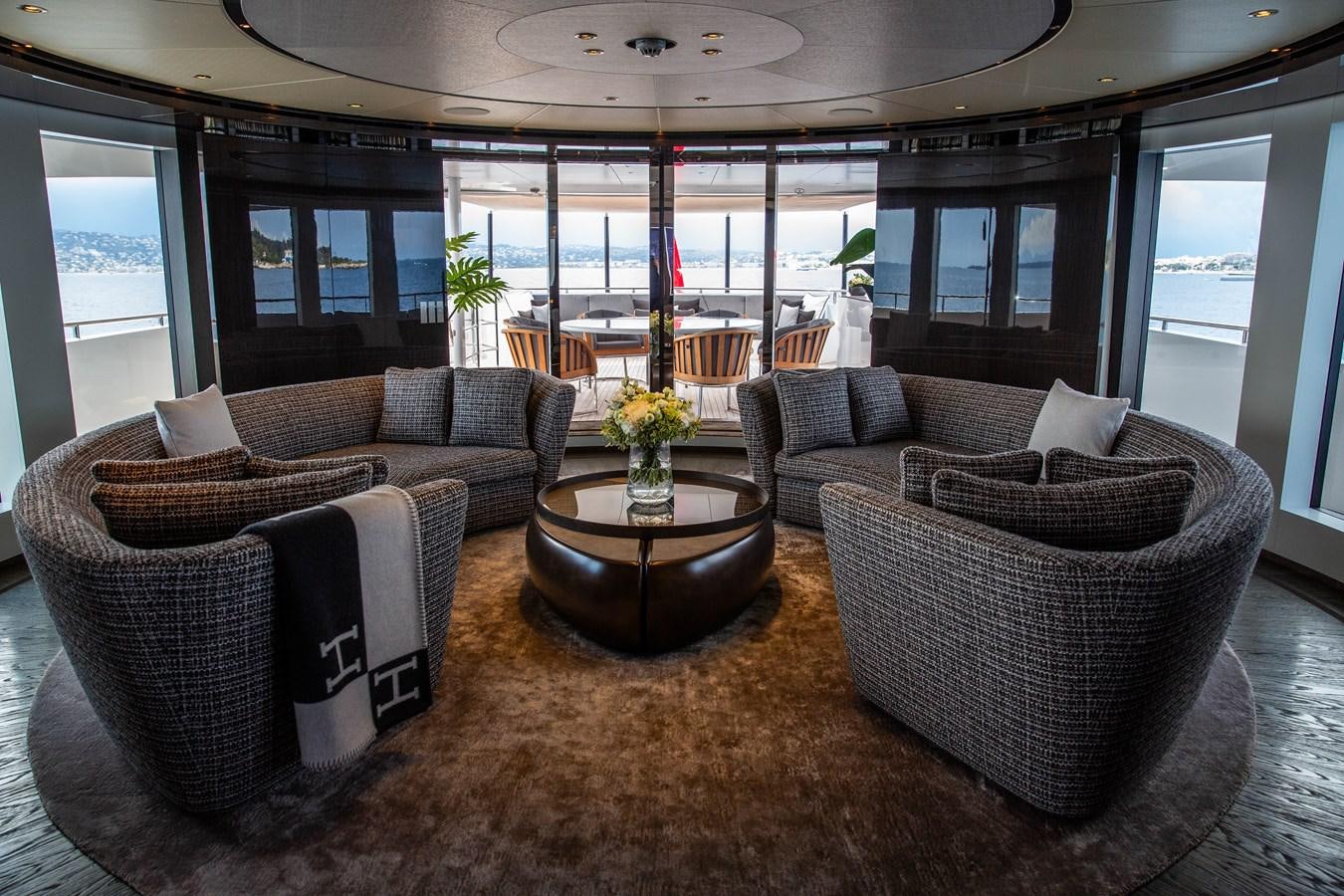 a living room with a table and chairs aboard VAN TOM Yacht for Sale
