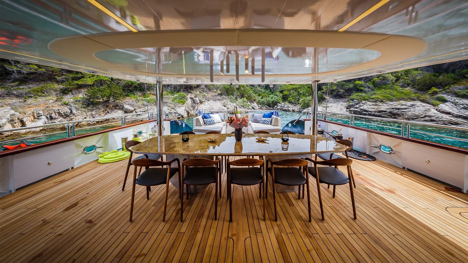 a table with chairs around it aboard CLASE AZUL Yacht for Sale