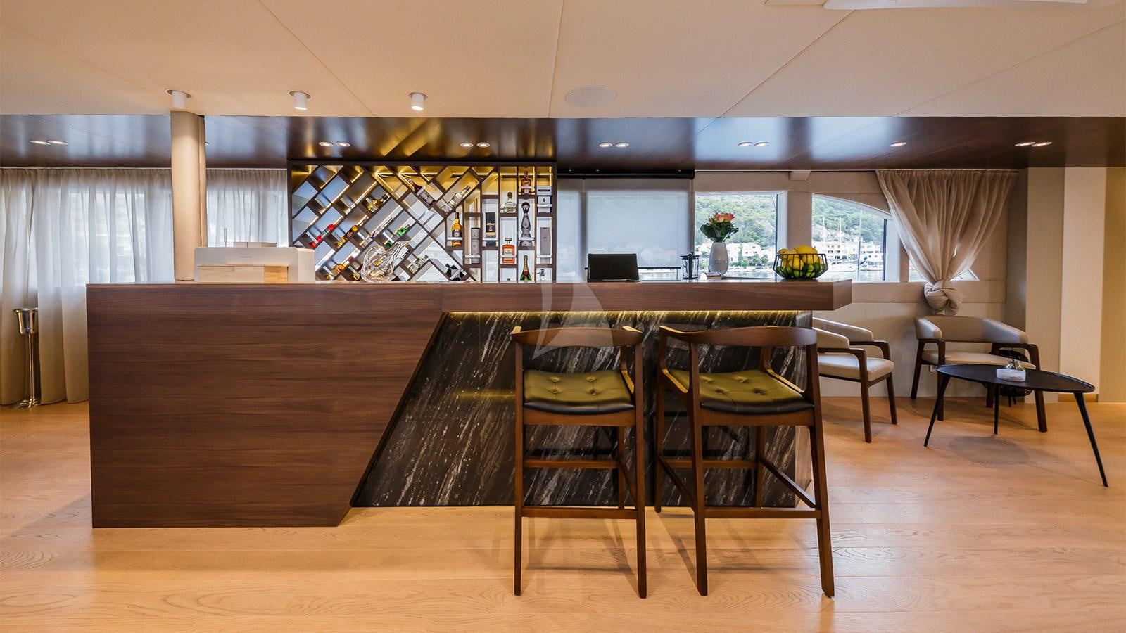 a room with chairs and tables aboard CLASE AZUL Yacht for Sale
