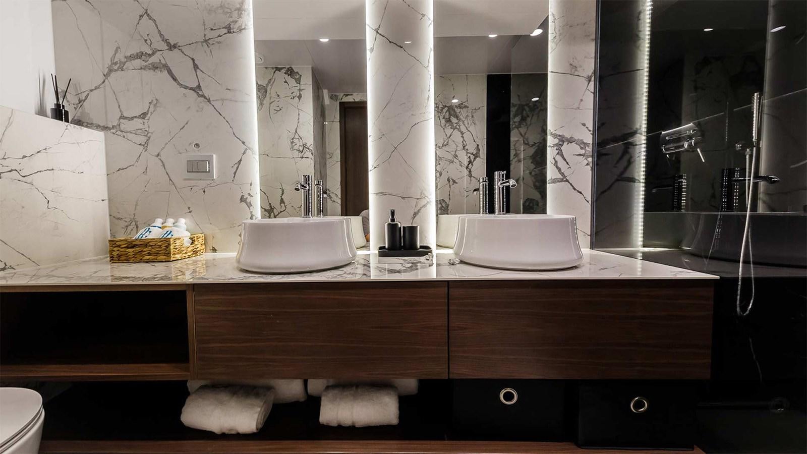 a bathroom with a sink and a mirror aboard CLASE AZUL Yacht for Sale