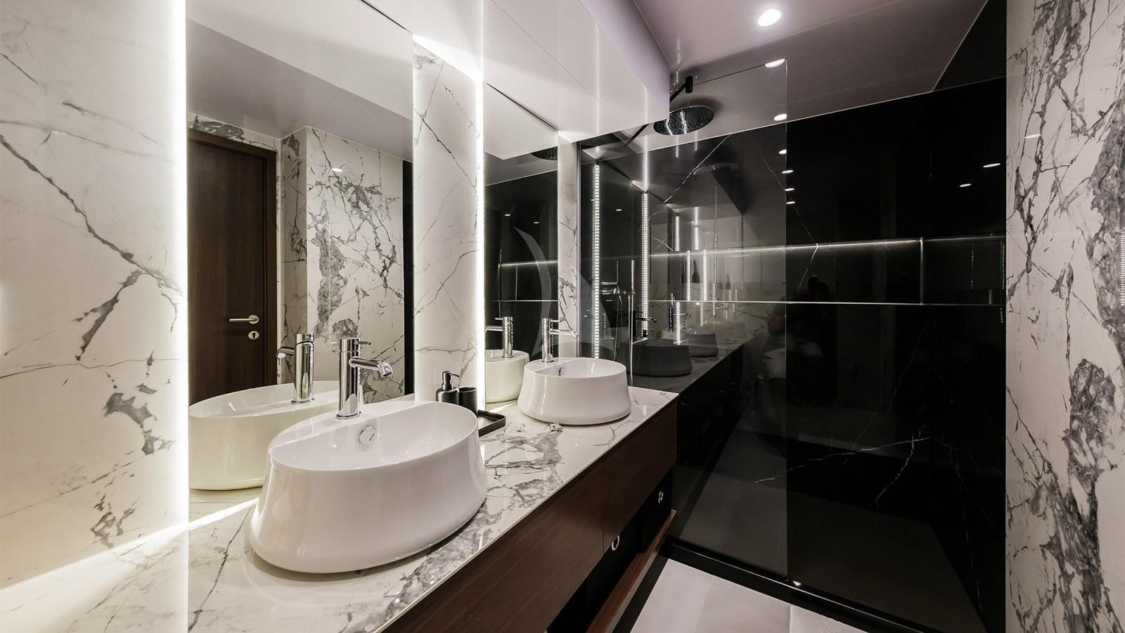 a bathroom with a sink and a mirror aboard CLASE AZUL Yacht for Sale