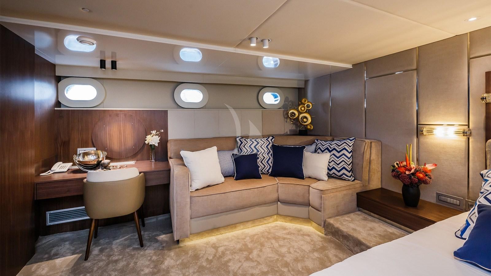 a room with a bed and a chair aboard CLASE AZUL Yacht for Sale
