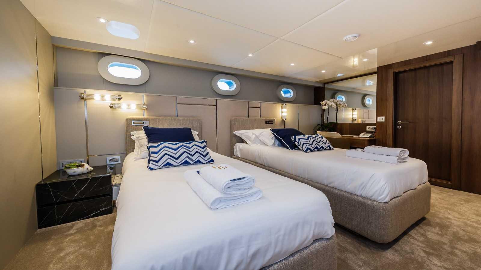 a room with two beds aboard CLASE AZUL Yacht for Sale