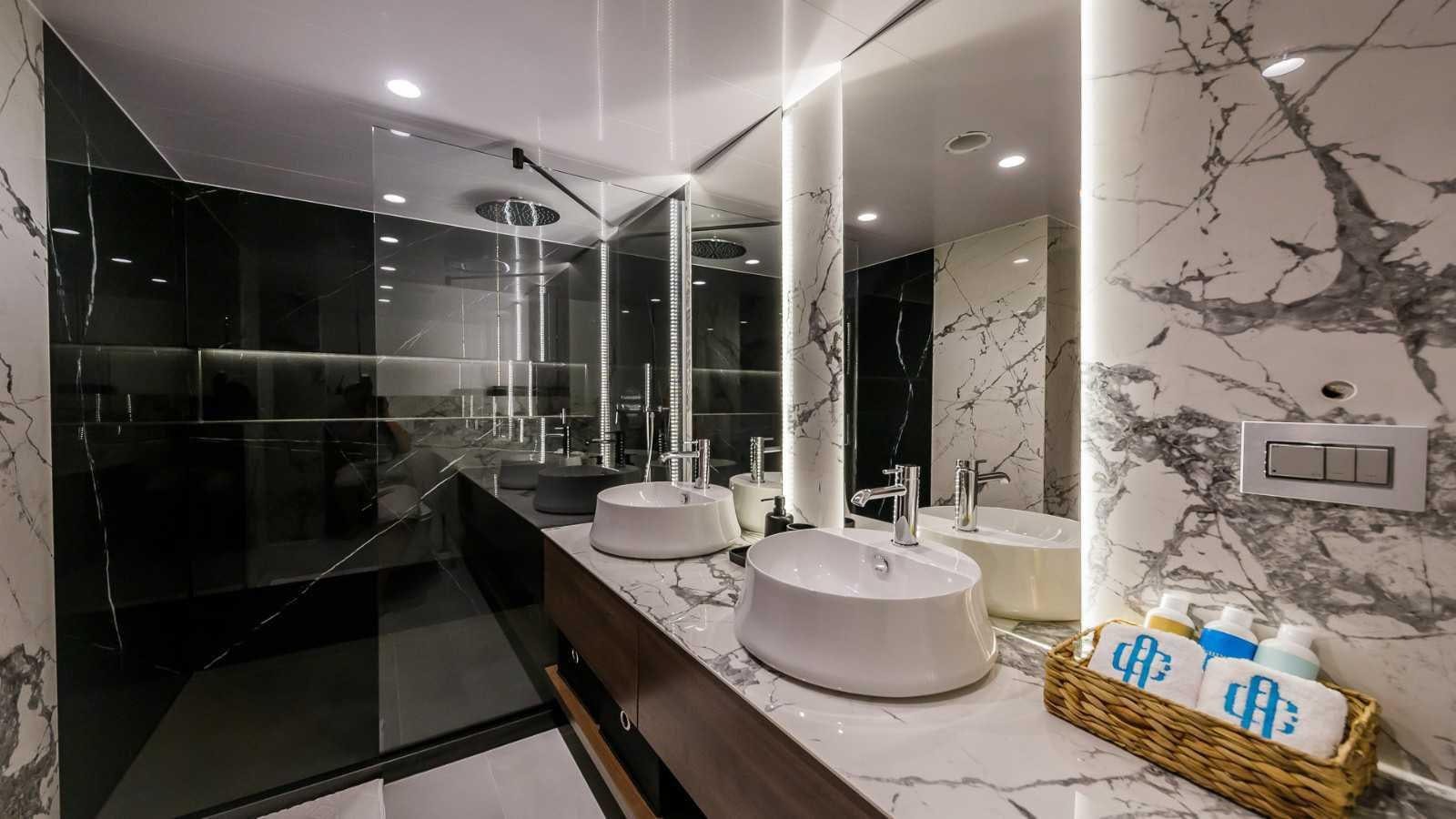 a bathroom with sinks and mirrors aboard CLASE AZUL Yacht for Sale