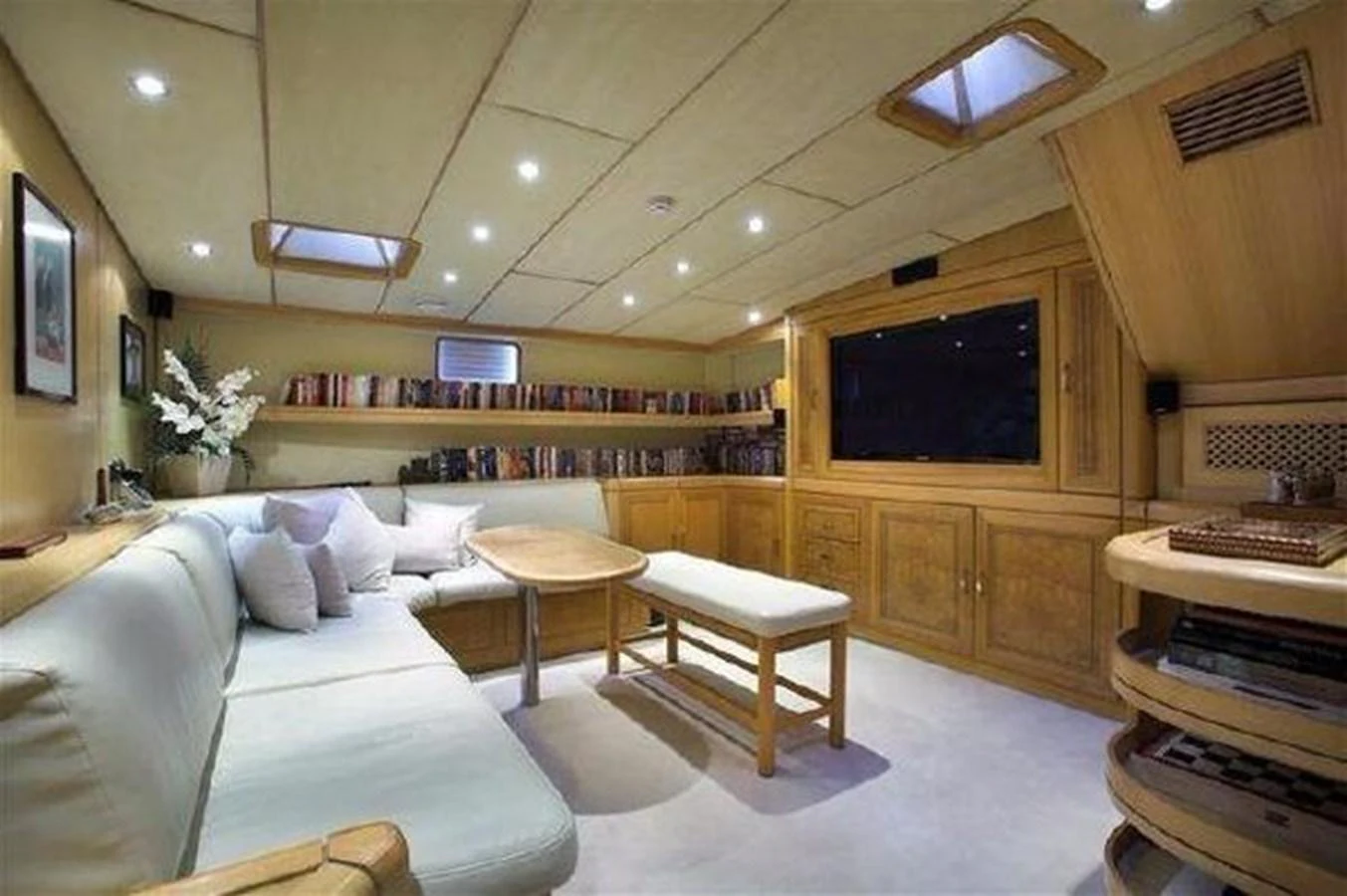 a room with a couch and a tv aboard ORIEL Yacht for Sale