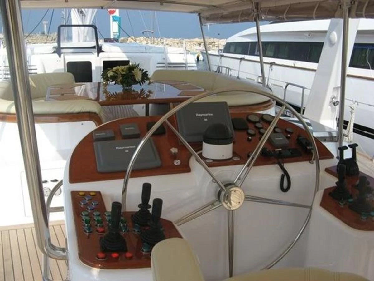 a boat with a steering wheel aboard ORIEL Yacht for Sale