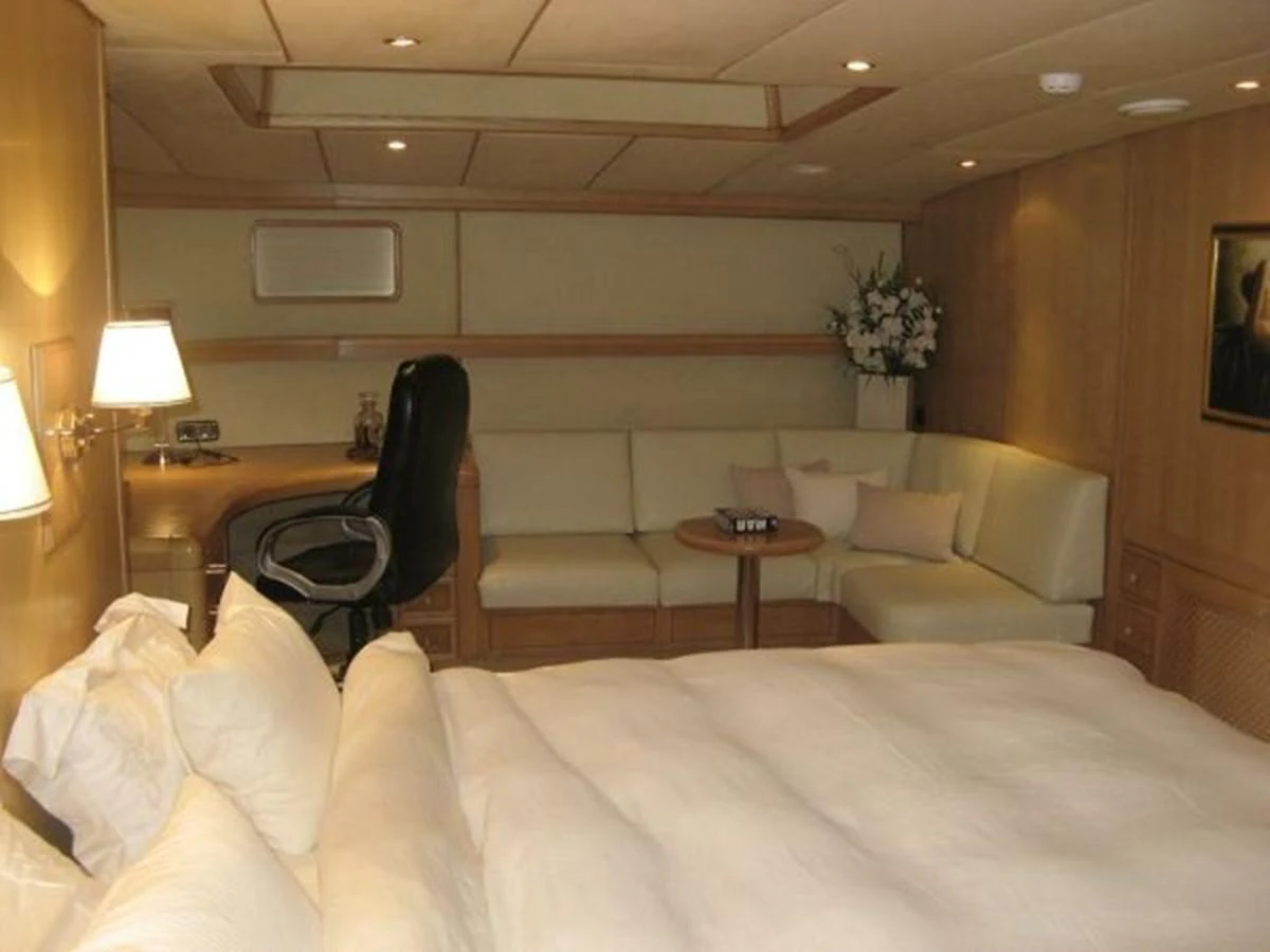 a room with a couch and a table aboard ORIEL Yacht for Sale
