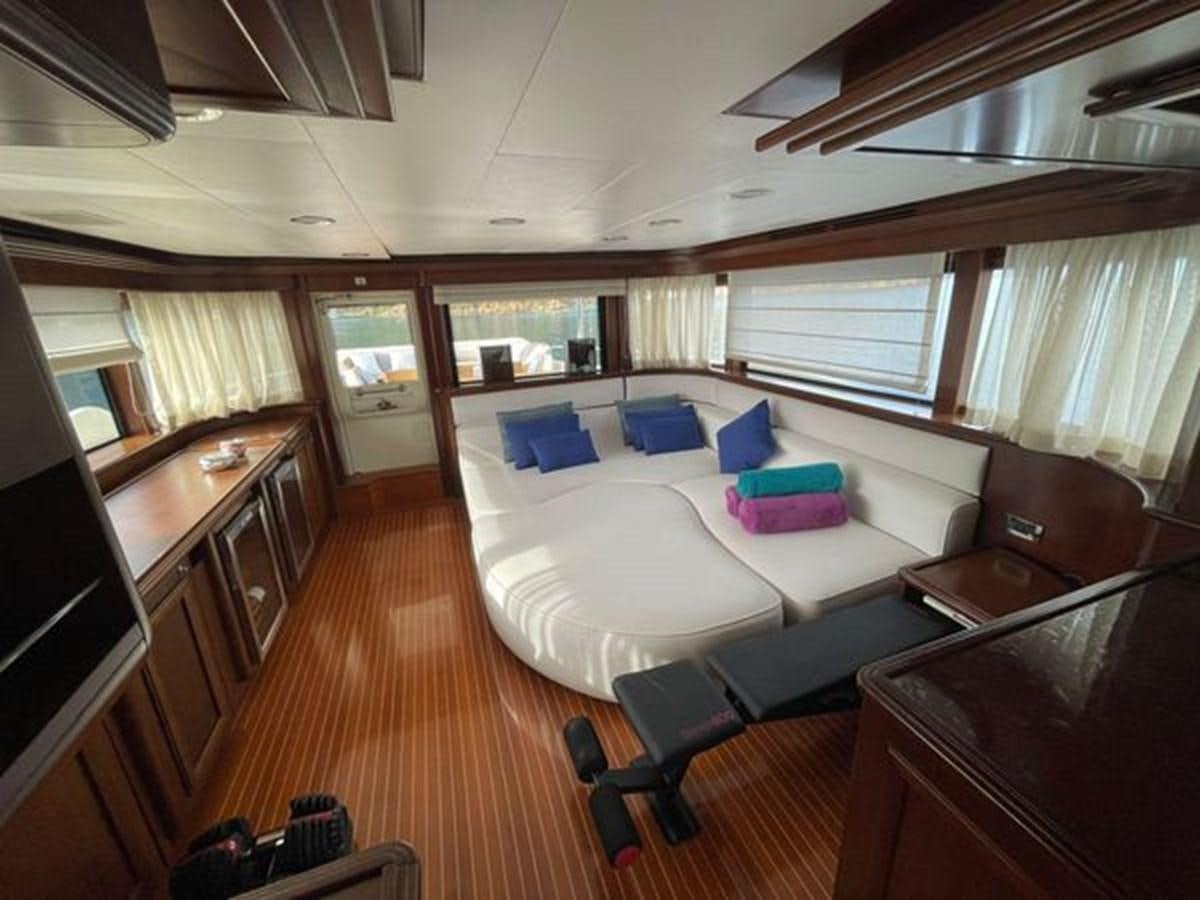 a room with a bed and a desk aboard STELLA MARIS Yacht for Sale