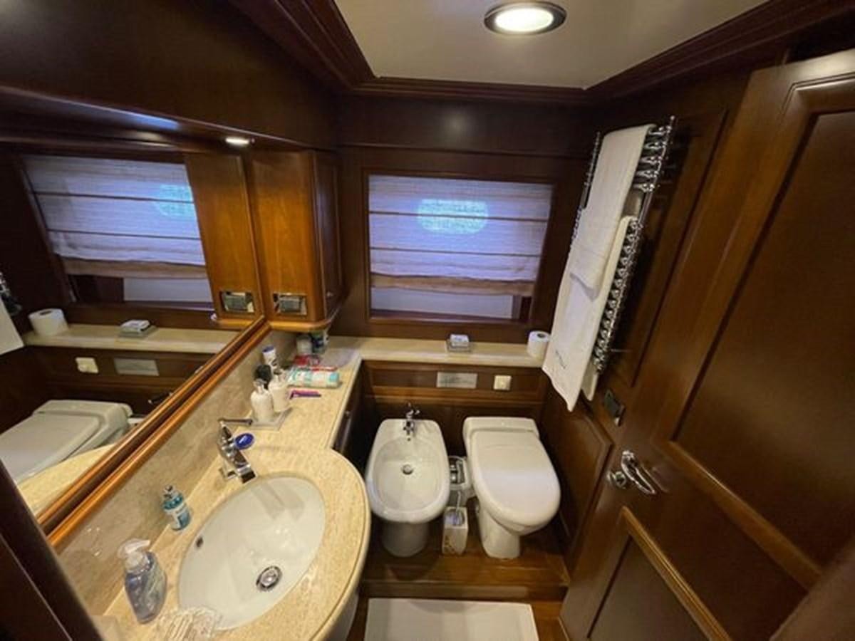 a bathroom with a sink and toilet aboard STELLA MARIS Yacht for Sale