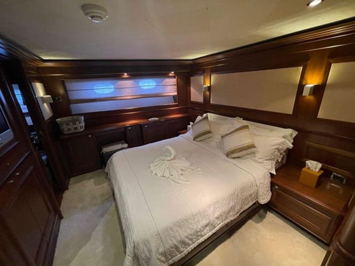 a hotel room with a bed aboard STELLA MARIS Yacht for Sale