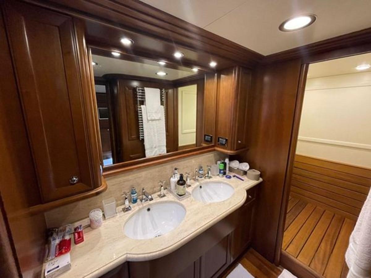 a bathroom with two sinks aboard STELLA MARIS Yacht for Sale