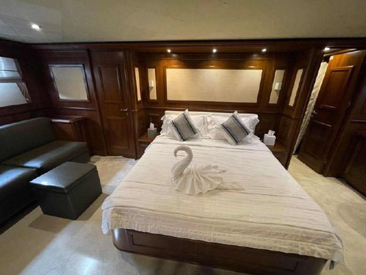 a bed in a room aboard STELLA MARIS Yacht for Sale