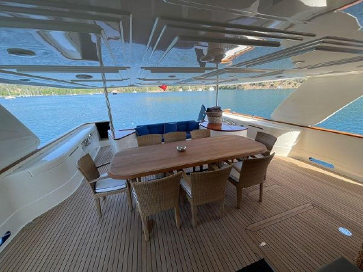 a table and chairs on a boat aboard STELLA MARIS Yacht for Sale