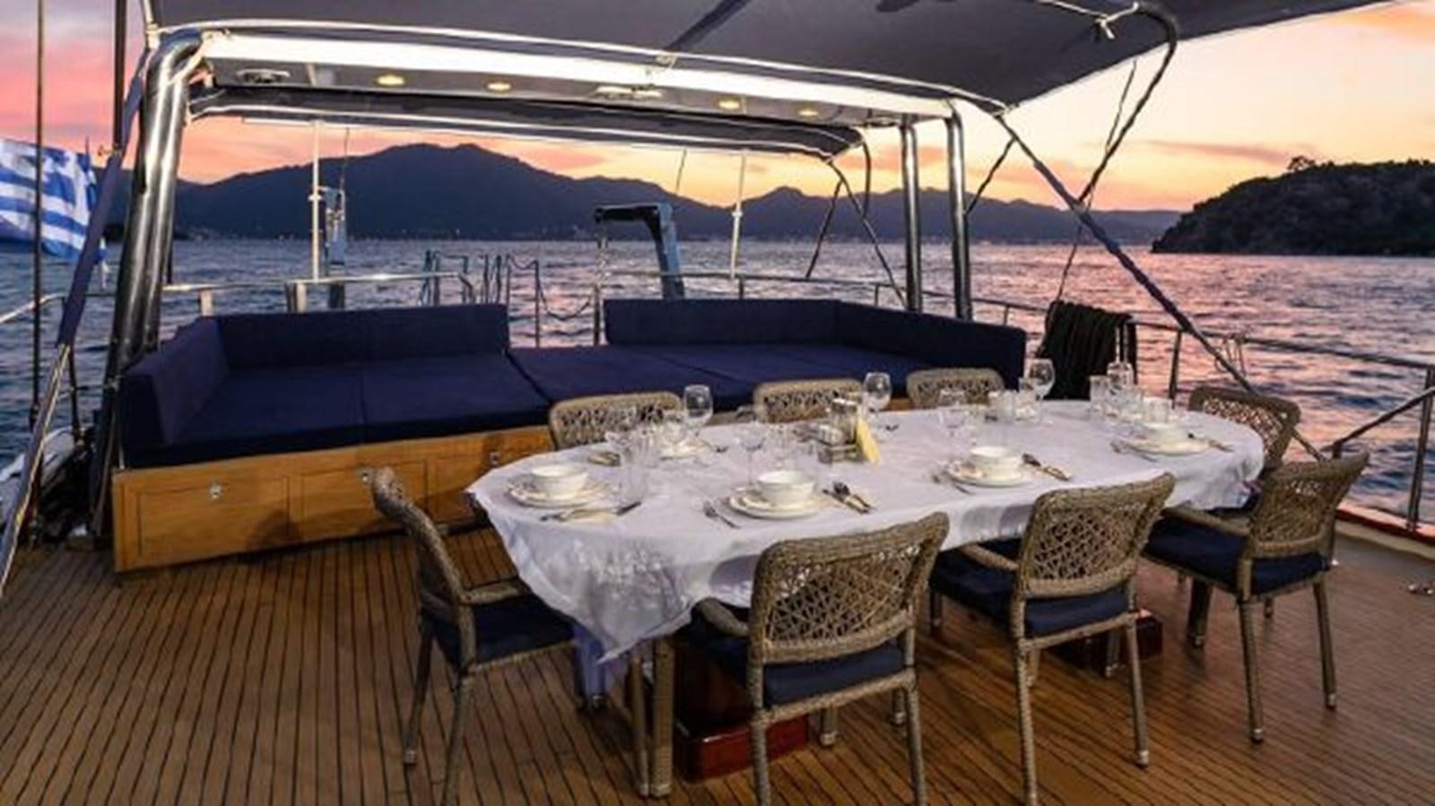 a table set for a dinner aboard VIVA SHIRA Yacht for Sale