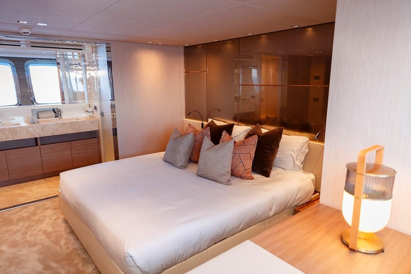 a bed in a room aboard LA SX88 Yacht for Sale