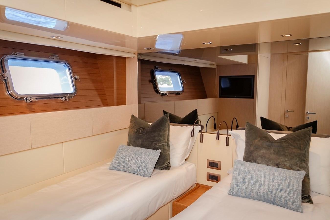 a room with couches and tv aboard LA SX88 Yacht for Sale