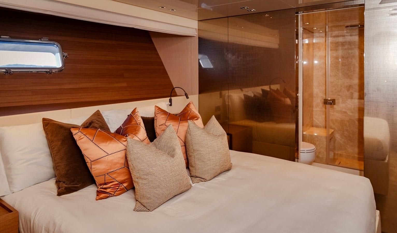 a bed with pillows aboard LA SX88 Yacht for Sale