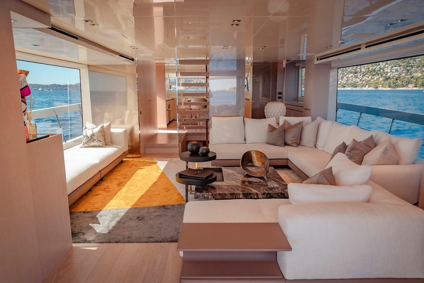 a living room with a staircase aboard LA SX88 Yacht for Sale