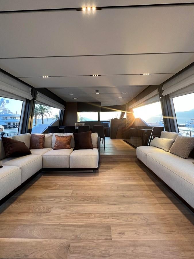 a living room with couches aboard AISULU Yacht for Sale