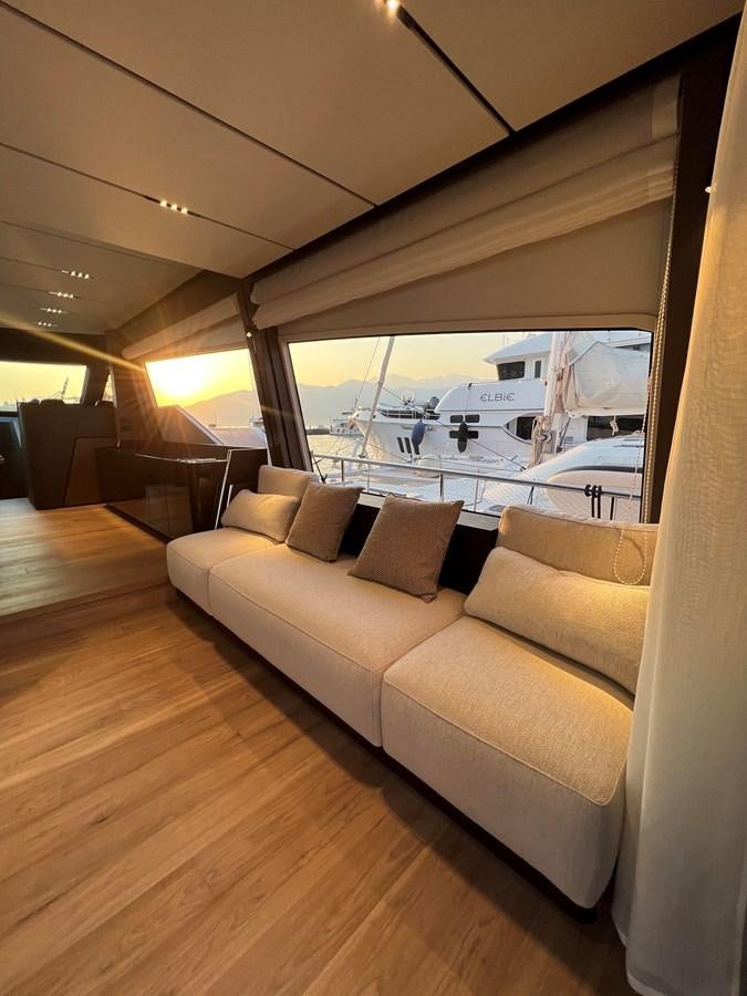 a couch in a living room aboard AISULU Yacht for Sale