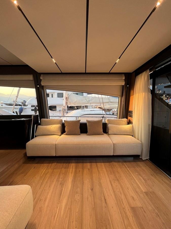 a couch in a room aboard AISULU Yacht for Sale