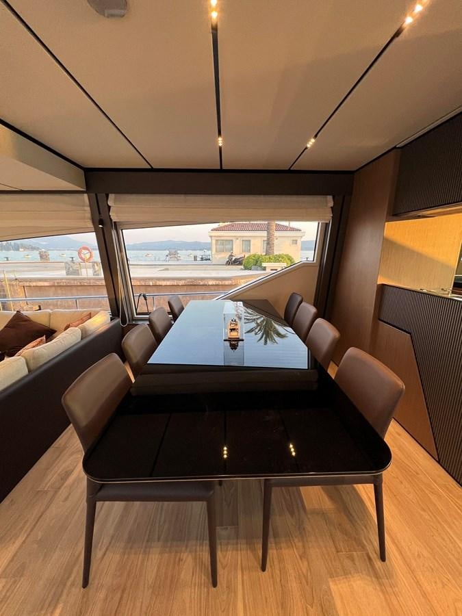 a table with a glass window aboard AISULU Yacht for Sale
