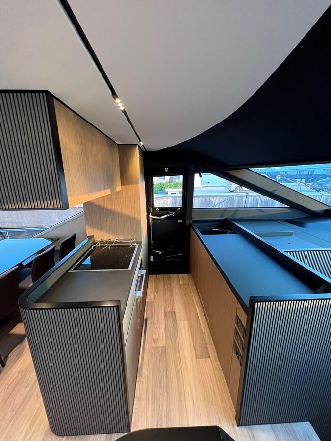 a room with a wood floor and a large window with a wood floor aboard AISULU Yacht for Sale