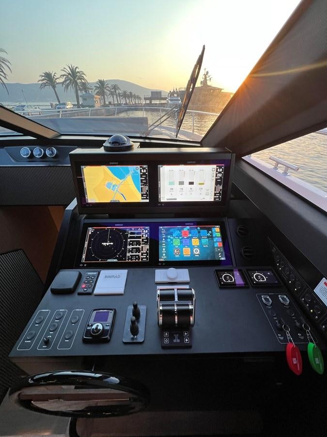 a car stereo and a screen aboard AISULU Yacht for Sale