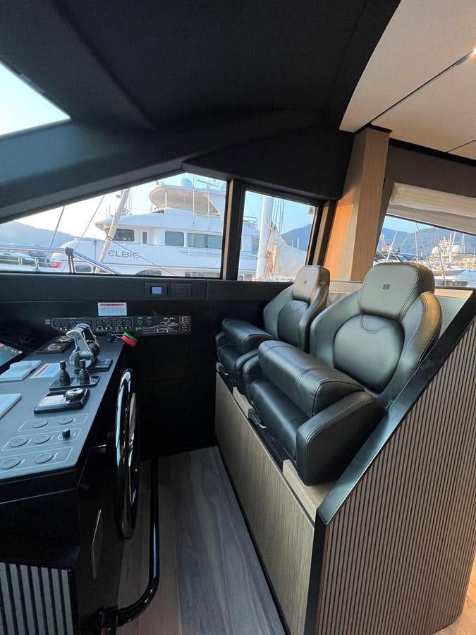 a vehicle with a desk and a computer aboard AISULU Yacht for Sale
