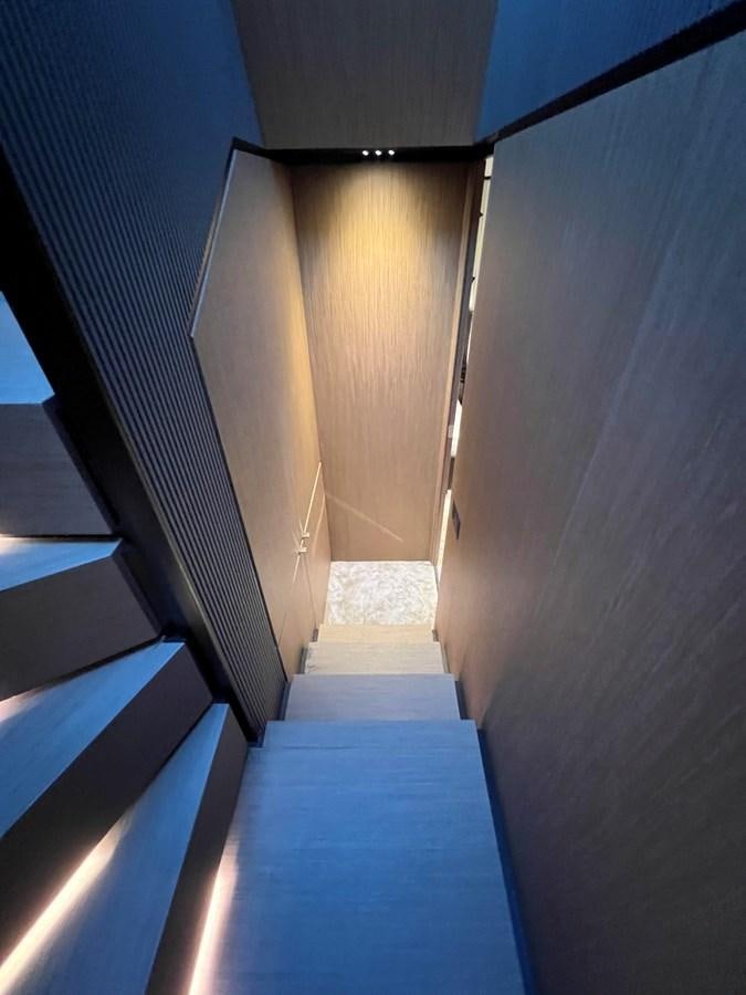 a hallway with a door aboard AISULU Yacht for Sale