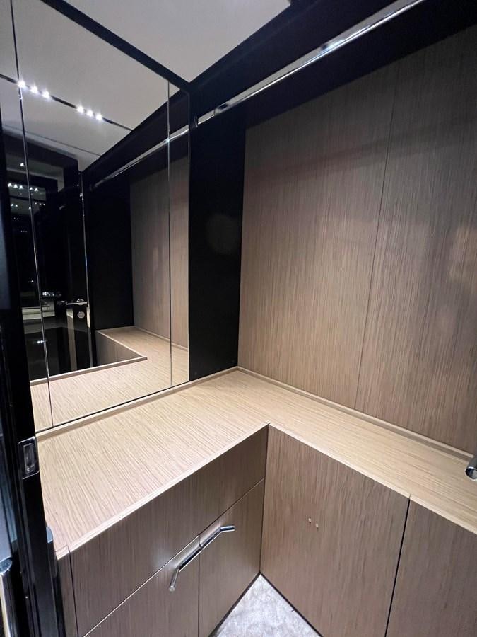 a bathroom with a large mirror aboard AISULU Yacht for Sale